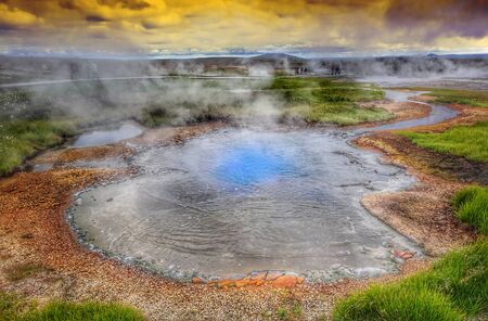 Hot steam over the source of the thermal waters, Hveravellir, Iceland. White nights in Iceland.の写真素材