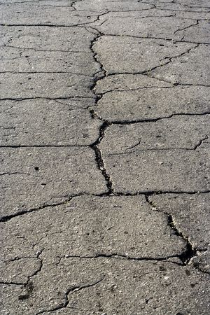 Old asphalt road surface texture with fissure