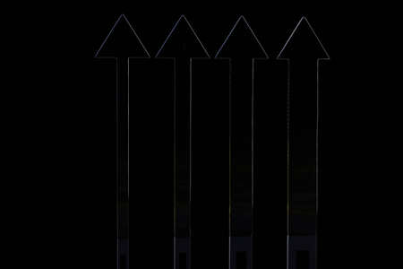  Arrows on black background isolated. Pointing up の写真素材