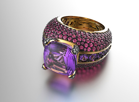 Golden Engagement Ring with amethyst. Jewelry backgroundの写真素材