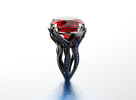 Golden Engagement Ring with Garnet. Jewelry backgroundの写真素材
