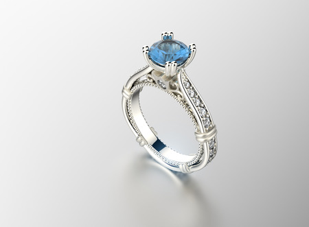 Golden Engagement Ring with Aquamarine. Jewelry backgroundの写真素材