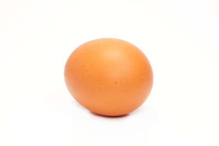 Chicken yellow egg is isolated on a white backgroundの写真素材