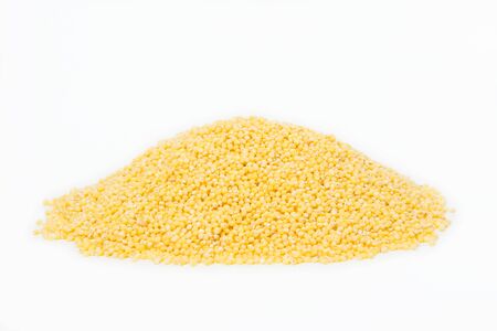 Small pile of millet isolated on white backgroundの写真素材