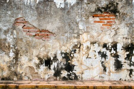 Red Old Brick Wall with Colorful Flags, Damaged Background.の写真素材