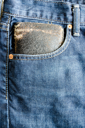 Close up Money Pocket in Front Pocket of Blue Jeans as Background Composition.の写真素材