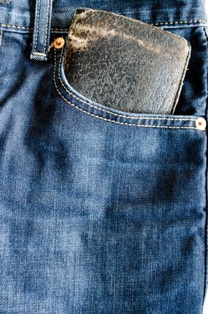 Close up Money Pocket in Front Pocket of Blue Jeans as Background Composition.の写真素材