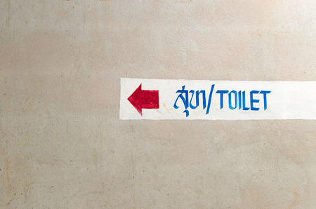 Toilet Sign on The Wall in the Traditional Temple, Thailand.の写真素材