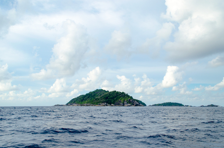 Beautiful Seascape with Focus on the Forest on the Mountain Rock in the Sea at Similan Islands, Thailand.の写真素材