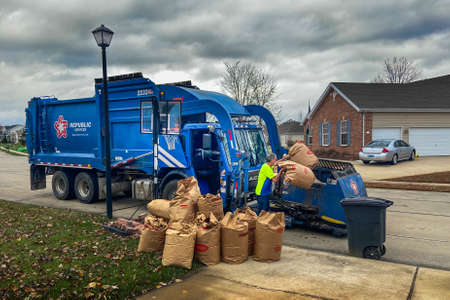Shiloh, ILâ€”Nov 10, 2020; Republic Services waste hauler truck and driver picking up...