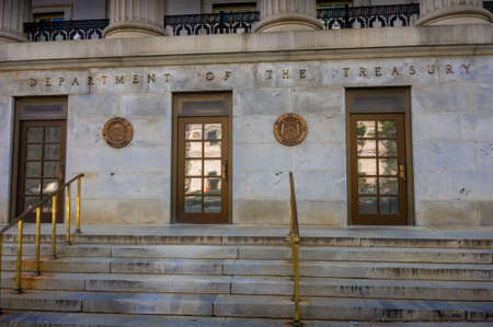 Washington DC--Aug 18, 2018; bronze doors, seals and words on building mark entrance to the United States Department of Treasury.のeditorial素材