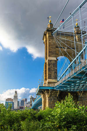 Cincinnati, OH--Aug 29, 2018; view of the south tower of John A. Roebling steel suspension bridge with downtown skyline in backgroundのeditorial素材