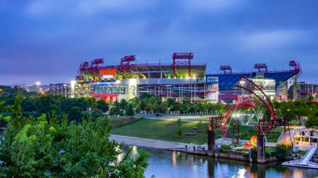 Nashville, TN--July 31, 2018; riverside view of Nissan Stadium home to Tennessee Titans NFL football team at sunrise with overcast skyのeditorial素材