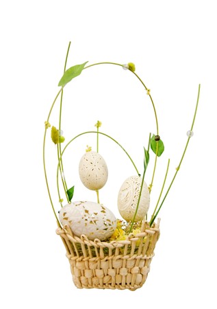 Wicker basket with decorative easter eggs isolated over whiteの写真素材