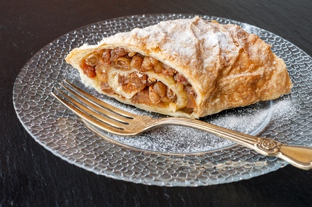 Piece of apple strudel on a plateの写真素材