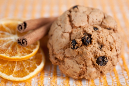 Homemade cookies with raisins and orange slicesの写真素材