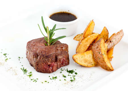 Steak and fried potatoesの写真素材