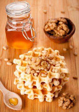 Healthy breakfast: waffles, nuts and honey の写真素材