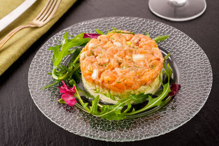 Salmon tartar with saladの写真素材
