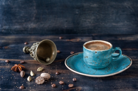 Espresso coffee and spices on the old wooden background and vintage bell. Coffee time concept.の写真素材