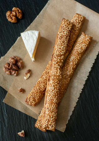 Bread sticks, walnuts and cheese camembert
