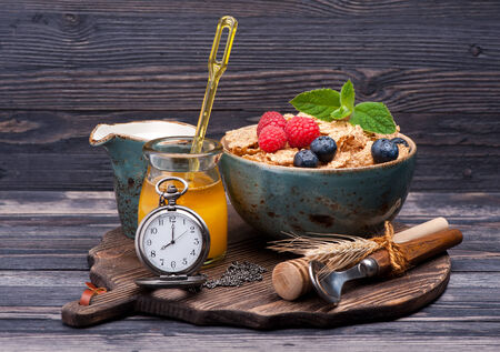 Muesli, berries, honey and milk. Healthy breakfast.の写真素材