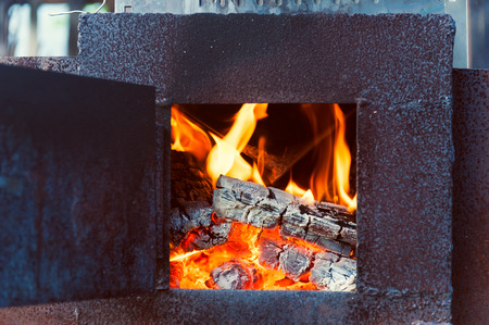 Flames in the old furnaceの写真素材