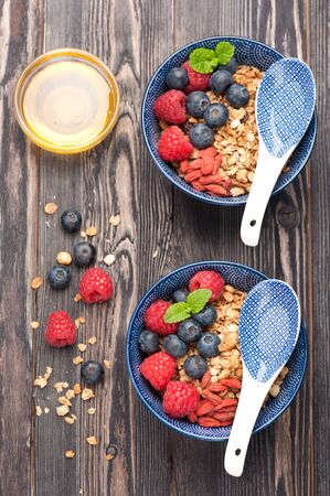 berries and granola for breakfast, top viewの写真素材