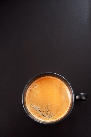 Espresso on a black background. top viewの写真素材