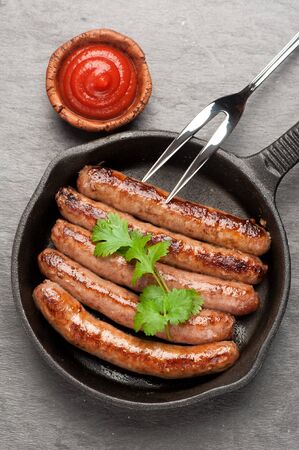 Grilled homemade sausages in a pan. Top viewの写真素材