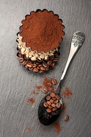 Grains roasted coffee, raw green coffee and ground coffeeの写真素材
