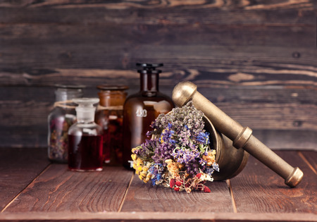 Medicinal herbs mortar and bottles tincture. Herbal medicineの写真素材