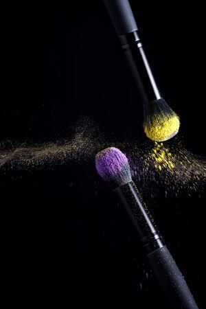 Makeup brushes and powder eyeshadow