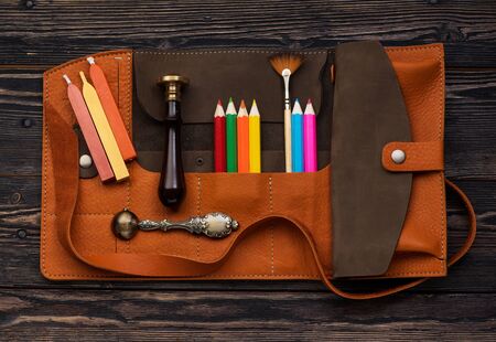 leather case with accessories for creativity. Wax seal, sealing wax, brush and pencils in leather...