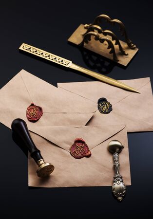 Old envelopes with red wax seal, letter opener and letter holder. Vintage writing accessoriesの写真素材