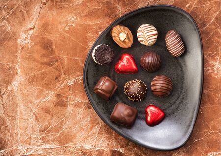 Chocolate candies in a plateの写真素材