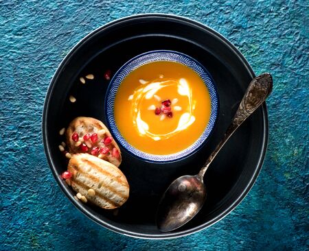 Pumpkin soup in a bowl, top viewの写真素材