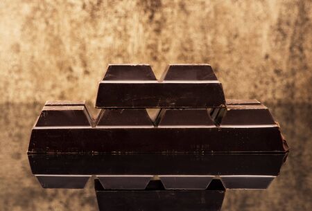 Blocks dark chocolate on a stone backgroundの写真素材