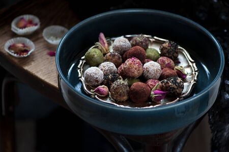 Raw vegan truffles candy gluten-free balls on a trayの写真素材