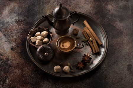Coffee composition. Cup coffee and spices on a dark old background.の写真素材