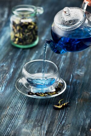 Blue tea Anchan in a glass teapot and a cupの写真素材