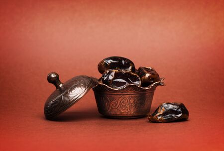 Dates in a bronze plate with a dark background
