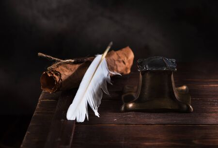 Ancient Inkwell, feather pen and old paper with a sealの写真素材