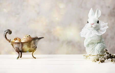 Happy Easter. Festive decoration with Easter eggs, willow branches and Easter bunnyの写真素材