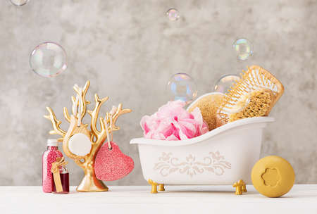Spa, skin care, body treatment, massage eco products. Dry massage brushes, handmade soap, aroma oil on a light background.の写真素材