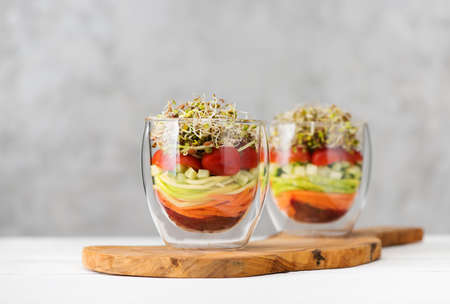 Salad in glass with microgreens and fresh vegetables. Healthy food, clean eating and vegetarian conceptの写真素材
