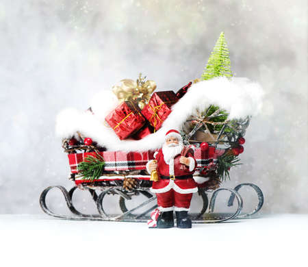 Merry Christmas and Happy Holidays! Santa Claus gives gifts.