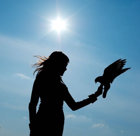Silhouette of girl and bird. Element of design.