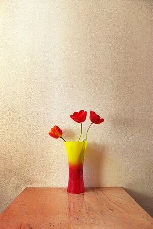 Three tulip in vase. Decoration in room.の写真素材