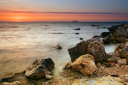 Sea and stone at the sunset. Nature composition.の写真素材